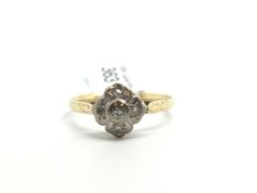 Vintage diamond cluster ring, platinum top set with four swiss cut diamonds, all mounted in yellow