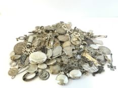 A quantity of mostly silver lockets, pendants, brooches including Edwardian and Victorian lockets