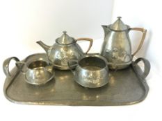 Five piece Tudoric pewter tea service, retailed by Liberty & Co, each piece numbered and marked â€˜