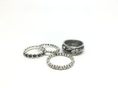 Pandora, four pandora rings including cz stone set cross over stacking ring and three bands