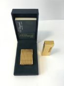 Dupont lighter boxed with paperwork together with a dunhill lighter
