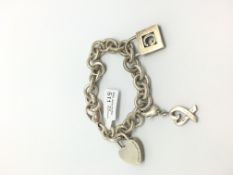 Tiffany & Co silver charm bracelet, three silver charms, 19cm, 46g