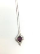 Pink stone and diamond pendant, in white metal stamped and tested as 18ct white gold