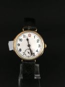 Gents 9ct Gold military trench watch. The dial is porcelaine with a red 12. The crown is a onion