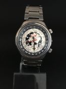 Gentleman's Ricoh World Timer day and date. The case and bracelet are stainless steel. The case is a