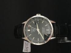 Gentleman's Tag Heuer Carrera Twin Time watch. The case is stainless steel glass screw back. The