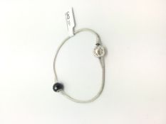Pandora bracelet with a single black faceted bead charm, 19.5cm