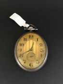 Dress Pocket watch in a Oval shape. The case is solid silver. Engine turned dial with arabic