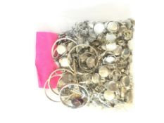 Selection of mainly silver jewellery, including silver charms, lockets and earring, gross weight