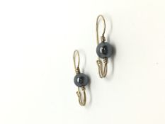 Hematite bead earrings, yellow french wire fittings, in yellow metal stamped and tested as 9ct