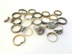 A quantity of 9ct and silver jewellery including 15+ rings and gem set pieces, approximately 59g