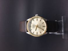 Gentleman's Air King Rolex. The watch has a stainless steel case with a gold bezel. Screw down