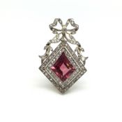 Pink tourmaline and diamond period brooch, unusual kite cut pink tourmaline set within a double