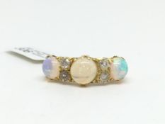 Opal and diamond carved half hoop ring, three 6-7mm round cut cabochon opals, spaced with two