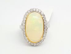 Opal and diamond ring, oval cabochon cut opal weighing an estimated 6.88cts, surrounded by round