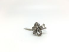Diamond set floral spray ring, floral design set with diamonds, continental marks, in white metal