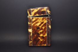 Tortoiseshell Style business card holder. The top is hinged and the pressed down opener is working