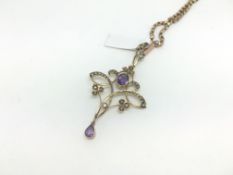 Amethyst and seed pearl nouveau pendant and chain, oval cut amethyst with seed pearl set detail,