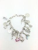Sterling silver charm bracelet, with fourteen charms including Thomas Sabo charms