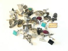 Bag of mostly silver and gem set cufflinks, gross weight approximately 214 grams