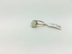 Opal ring, 10x8mm cabochon opal double claw mounted in yellow metal stamped and tested as 9ct,