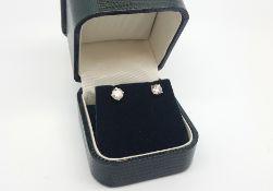 Single stone diamond ear studs, round brilliant cut diamonds weighing an estimated 0.60ct each, four