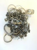 Quantity of mostly silver jewellery including bangles and charm bracelets, gross weight
