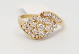 Diamond cluster ring, round brilliant cut diamonds in a crossover design, mounted in 18ct yellow