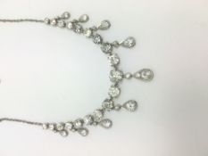 Old cut diamond riviere necklace, graduating old cut diamonds four claw set, 0.10ct to approximately