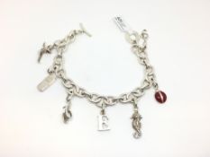 Links of London silver charm bracelet, seven charms including; sea horse, lady bird and fairy, 21cm