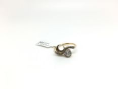 Diamond crossover ring, singe old cut diamond weighing an estimated 0.60ct, other 6.6mm mount empty,