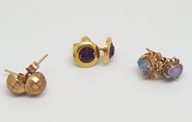 Three pairs of 9ct gold stud earrings, including a pair of opal triplet ear studs and a pair of