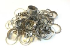 Bag of mostly silver, including charm bracelets and bangles, gross weight approximately 1664 grams