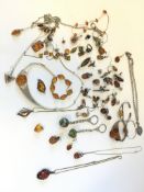 Quantity of amber set silver jewellery, including necklaces, pendants, and rings gross weight