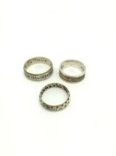 Three 9ct and silver band ring, gross weight approximately 10.8 grams