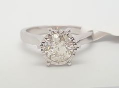 Single stone diamond ring, round brilliant cut diamond weighing an estimated 1.32cts, in an illusion