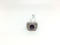 Amethyst and diamond platinum cocktail ring, central round cut amethyst with a cluster of diamonds ,