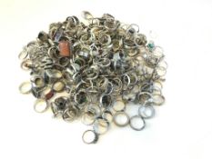 Bag of mostly silver gem set rings, gross weight approximately 1154 grams