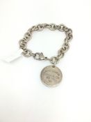 Tiffany & Co silver bracelet, circular charm with lobster clasp
