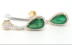 Emerald and diamond drop earrings, pear cut emerald weighing an estimated 2.80cts, surrounded by