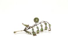 Russian demantoid garnet floral brooch, rose gold stem with garnet set cluster, five suspended stone