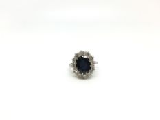 Sapphire and diamond cluster ring, 11.3x9.1mm oval cut sapphire, estimated weight 4.45ct, set with a