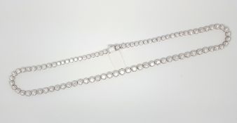 Diamond riviere necklace, eight-nine round brilliant cut diamonds, each illusion set, estimated