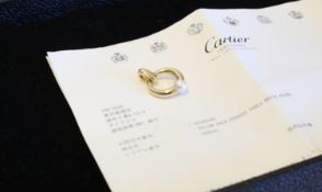 Cartier - Pearl and gold pendant, central 8mm peal illusion set within a yellow gold hoop, signed