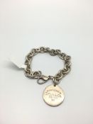 Tiffany & Co silver bracelet, circular charm with lobster clasp