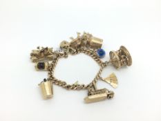 Heavy 9ct Gold Charm Bracelet. 71.4g. Including moving charms.