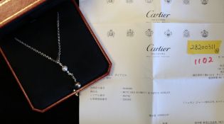 Cartier So Pretty diamond and pearl necklace, 9mm black pearl suspended from 7.5mm white pearl,