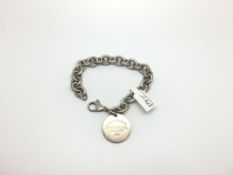 Tiffany & Co silver bracelet, circular charm with lobster clasp