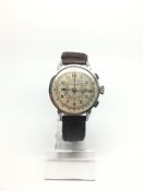 An oversized 1940s Gentlemen's Girard Perragaux Chronograph manual wind watch. The case is stainless