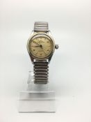 Vintage Rolex Oyster perpetual Precision, cream patinated dial with dagger and Arabic numeral hour